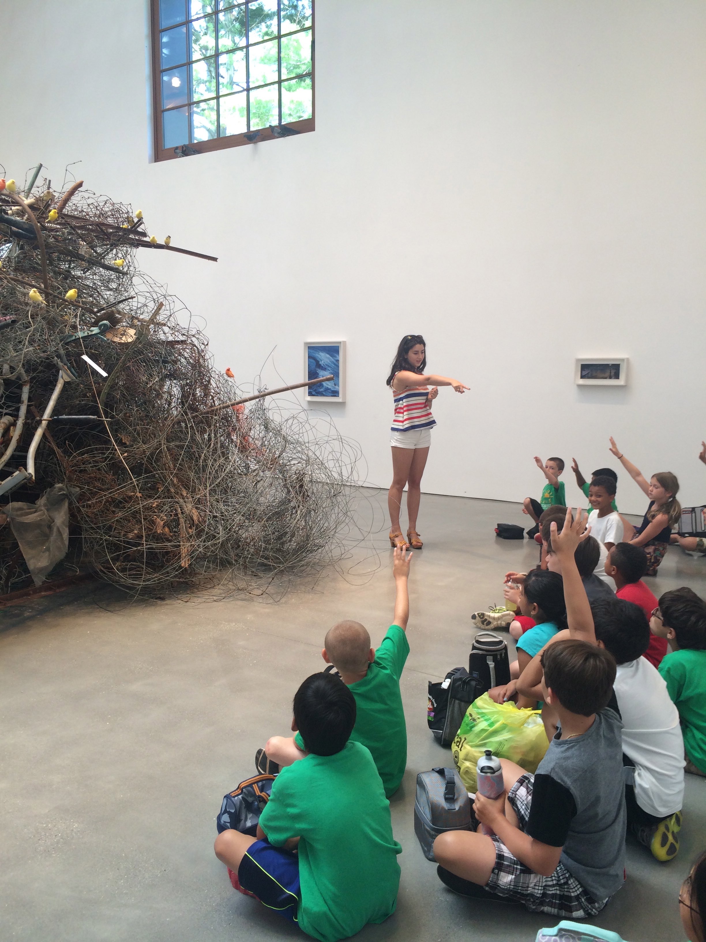 Students visit Dan Colen's exhibition at The Brant Foundation. 